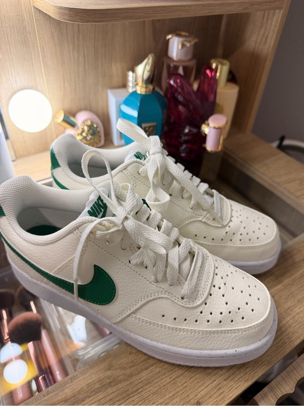 Nike Kids White Leather Sneakers with Green Swoosh Accent
